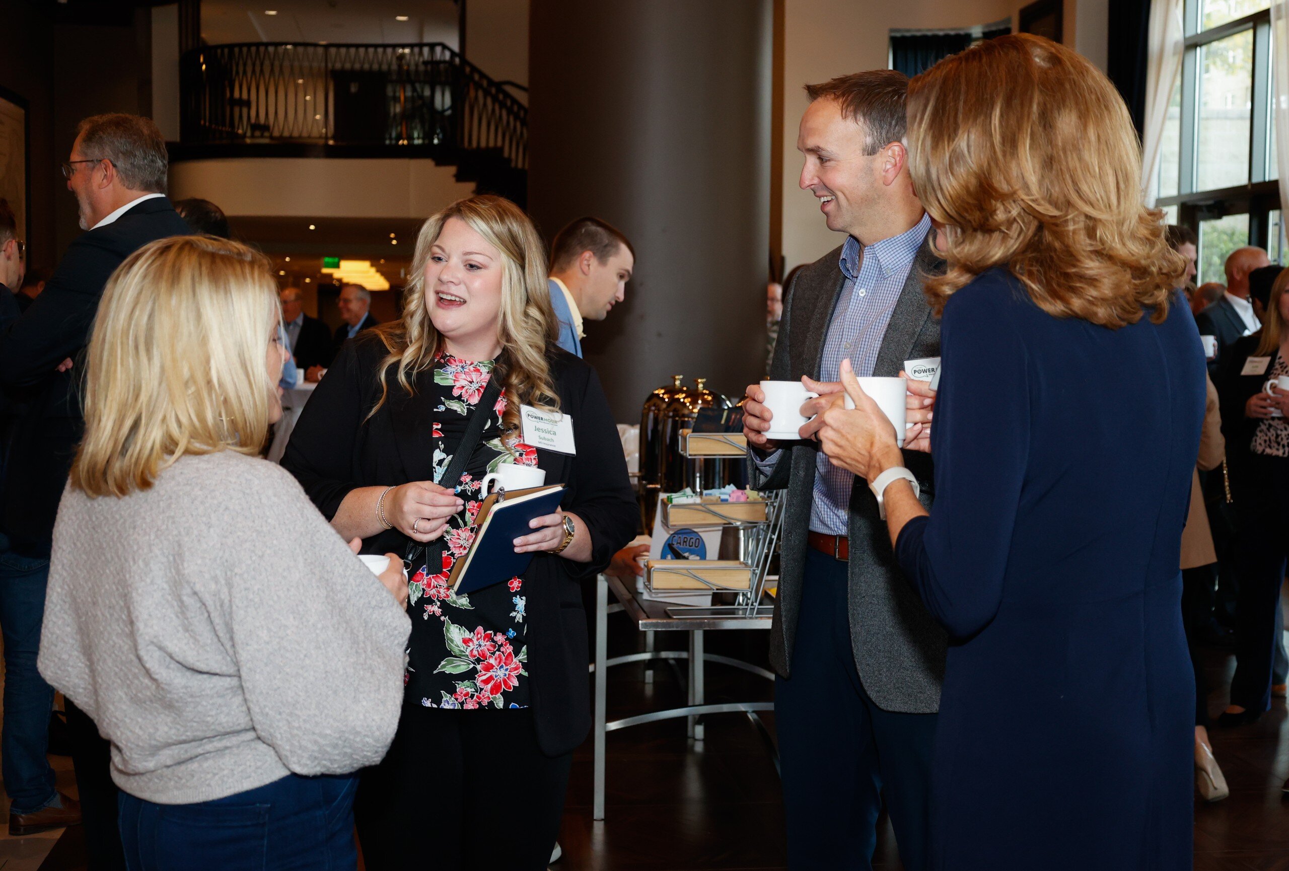 _E0A7645 Group networking event with coffee and conversation.
